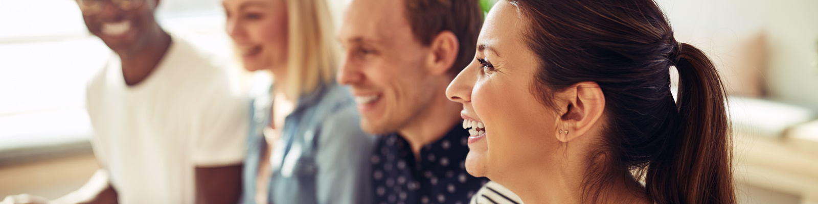 Diverse people laughing together during an event