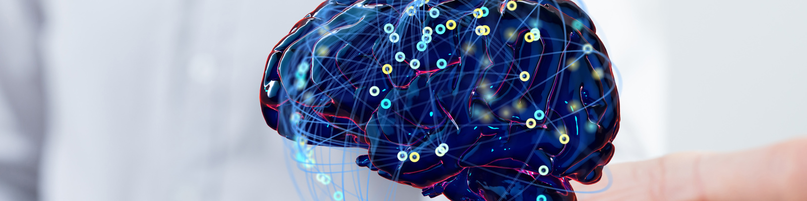 Photo of a Hand with a CGI brain floating above it, with Idea Icons and Symbols Floating Around It.