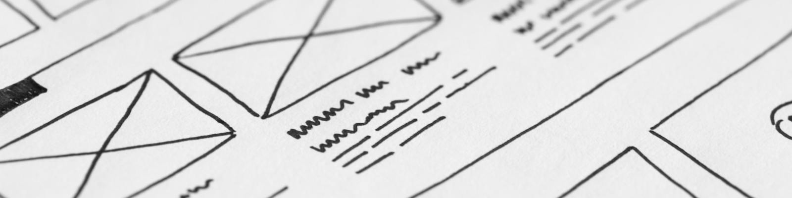 A piece of white paper with a line drawing of some envelopes and sample text underneath
